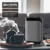 A heater is placed on a table next to a teapot and mug, with steam rising from the teapot. Produktbild-Vorschau
