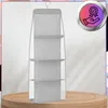 A hanging organizer with multiple shelves is displayed against a textured wall and on a wooden surface. Produktbild-Vorschau