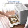 A person is scooping cat litter from a drawer of a cat litter box. Náhled obrázku produktu
