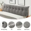 A long, wedge-shaped pillow with button tufting, placed on a bed. The image is a collage with close-up shots of the pillow's features. Produktbild-Vorschau
