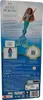 The back of a toy doll's packaging, showing the doll and product information. Voir les images du produit