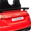 Close-up of the rear of a red toy car, showing the Audi logo, model name, and a spoiler. Produktbild-Vorschau