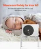 A sleeping baby next to an air conditioner unit on a stand. Náhľad obrázku produktu
