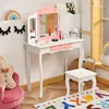A child's play vanity set with a chair in a room with decorative wall art and a rug. Náhľad obrázku produktu