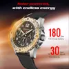 A close-up marketing image of a solar-powered watch with text overlays highlighting its features. Náhled obrázku produktu