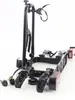A black bicycle rack with red taillights, shown against a white background. Voir les images du produit