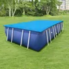 An inflatable swimming pool with a blue solar cover is set up on a green lawn, with trees and a house in the background. Produktbild-Vorschau