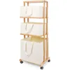A three-tiered bamboo laundry basket with beige fabric bins on a white background. Anteprima dell’immagine prodotto
