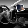 A tablet holder mounted in a car, positioned near the steering wheel and gear shift. Produktbild-Vorschau