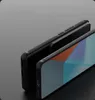 Two black phone cases are shown in a studio setting with a dark background. Podgląd zdjęcia produktu