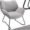 A light gray bouclé armchair with black metal legs is shown against a white background. Náhled obrázku produktu