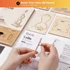 Hands assembling a wooden 3D puzzle of a cello, with instructions and puzzle pieces visible. Anteprima dell’immagine prodotto
