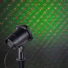 A black laser light projector emits red and green dots onto a dark background. Produktbild-Vorschau