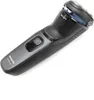 A black electric shaver is shown against a white background. Podgląd zdjęcia produktu