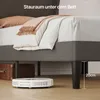 A bed frame with bedding and a robot vacuum cleaner underneath, showing storage space. Anteprima dell’immagine prodotto
