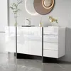 A modern white sideboard with a glossy finish is displayed in a well-lit room with a textured wall and a decorative mirror. Anteprima dell’immagine prodotto