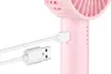 Eine Nahaufnahme zeigt den Unold Handventilator Breezy II beim Laden über USB; der Stecker befindet  Produktbild-Vorschau