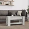A coffee table in front of a sofa in a living room setting. Náhľad obrázku produktu