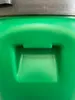 A close-up view of the handle and textured surface of a green plastic barrel. Produktbild-Vorschau