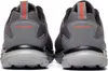 The back view of a pair of gray Skechers athletic shoes. Voir les images du produit