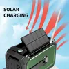 A close-up of a portable emergency radio with a solar panel tilted upwards, set against a sky background with red arrows indicating solar charging. Podgląd zdjęcia produktu