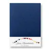 A folded navy blue jersey fitted sheet is presented on a white background. Below the sheet, a strip of white paper displays a rainbow of small colored circles, representing color options, and text. Produktbild-Vorschau
