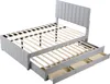 A light gray upholstered bed frame with a slatted mattress support and a pull-out trundle bed with drawers underneath, shown against a white background. Voir les images du produit