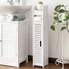 A white bathroom storage unit next to a sink and a cabinet. Náhled obrázku produktu