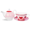 A white teapot with red polka dots and a matching teacup and saucer with red hearts and polka dots, all on a white background. Anteprima dell’immagine prodotto