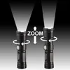 Two identical flashlights are shown, one with a wider beam and one with a narrower beam, illustrating the zoom function. Produktbild-Vorschau