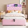 A pink upholstered bed with a tufted headboard and built-in LED lighting, set in a bedroom with bedside tables and decor. Produktbild-Vorschau