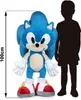 A large plush toy of Sonic the Hedgehog is shown next to a silhouette of a child to indicate its size. Voir les images du produit