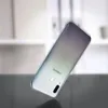 A smartphone is shown from the back, angled and slightly blurred, against a light background. Náhled obrázku produktu