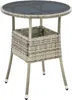 A round outdoor table made of polyrattan with a glass top and a storage compartment. Produktbild-Vorschau