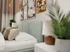A bedroom scene with a bed, pillows, lamps, and artwork on the wall. Produktbild-Vorschau