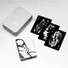A set of Star Wars themed playing cards and their tin case are displayed on a white surface. Anteprima dell’immagine prodotto