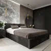 A modern bedroom with a large bed, wardrobe, and decorative wall elements.