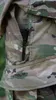 A close-up of a black flashlight partially inserted into the pocket of a camouflage uniform. Produktbild-Vorschau