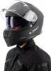 A person wearing a black motorcycle helmet and jacket. Anteprima dell’immagine prodotto