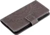A gray flip phone case with a mandala pattern. Produktbild-Vorschau