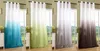 Four different colored gradient curtains hanging on a window. Produktbild-Vorschau