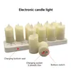 A set of electronic candles on a charging base, with labels pointing out features. Produktbild-Vorschau