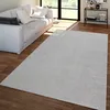 A living room scene with a sofa and a rug. Produktbild-Vorschau