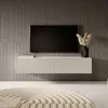 A modern TV stand with a TV mounted above it, in a minimalist room setting. Voir les images du produit