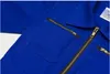 Close-up view of a blue garment with zippers. Produktbild-Vorschau