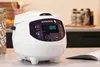 A digital rice cooker on a kitchen counter next to a jar of grains and an open manual. Anteprima dell’immagine prodotto
