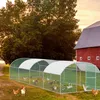 A large chicken coop with a curved roof is set up in a grassy yard with a red barn in the background. Several chickens and ducks are inside and around the coop. Náhled obrázku produktu