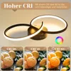 A modern ceiling light fixture with two intertwined rings, shown with comparative images illustrating different CRI (Color Rendering Index) levels. Voir les images du produit
