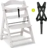 A white wooden high chair and a black safety harness are displayed against a white background. Podgląd zdjęcia produktu