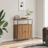 A wooden sideboard with two doors and a shelf above, placed in a room with a plant and a framed picture on the wall. Voir les images du produit